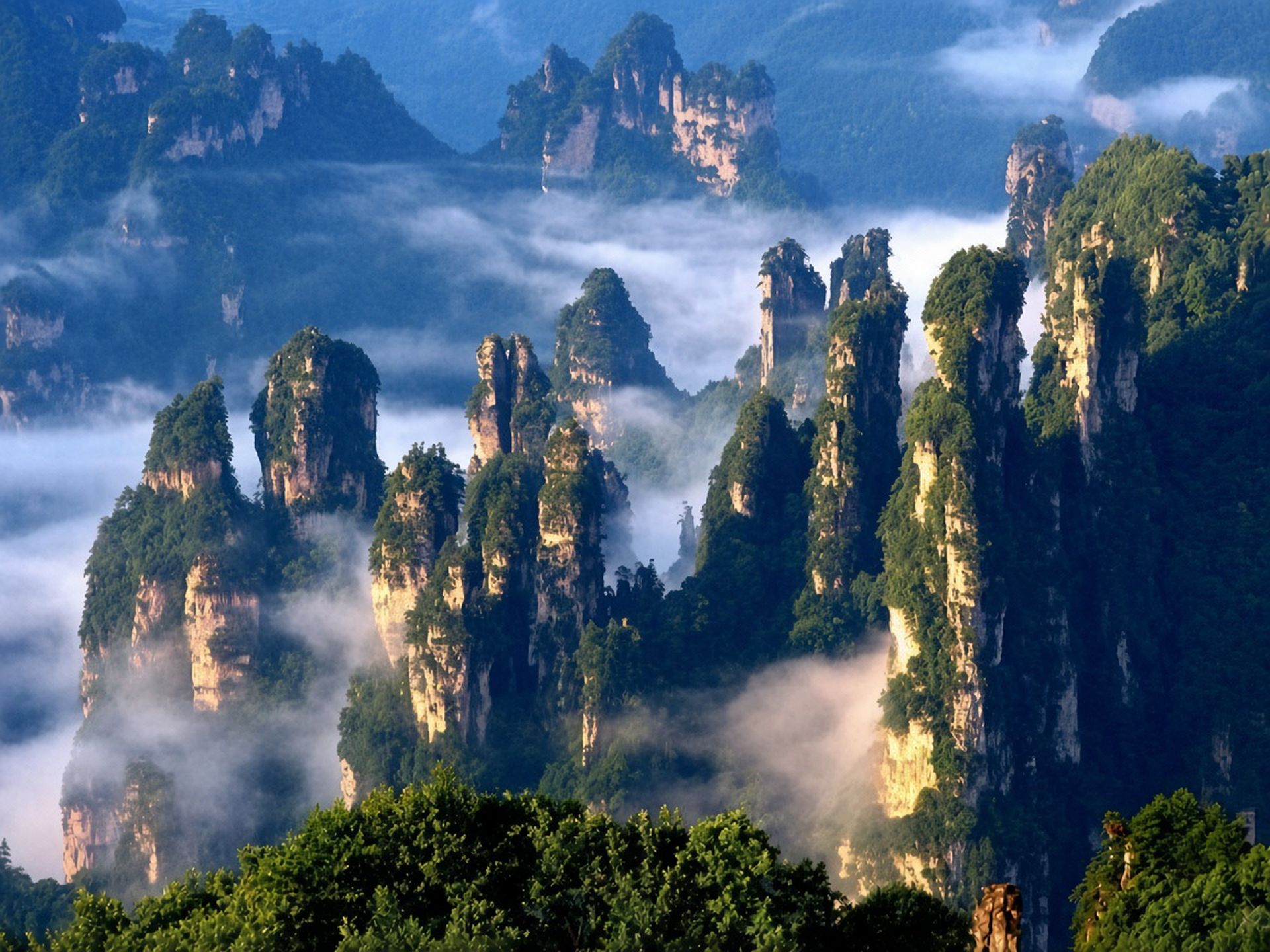 The stone pillars at Zhangjiajie. On the 14-day they come right after Guilin.