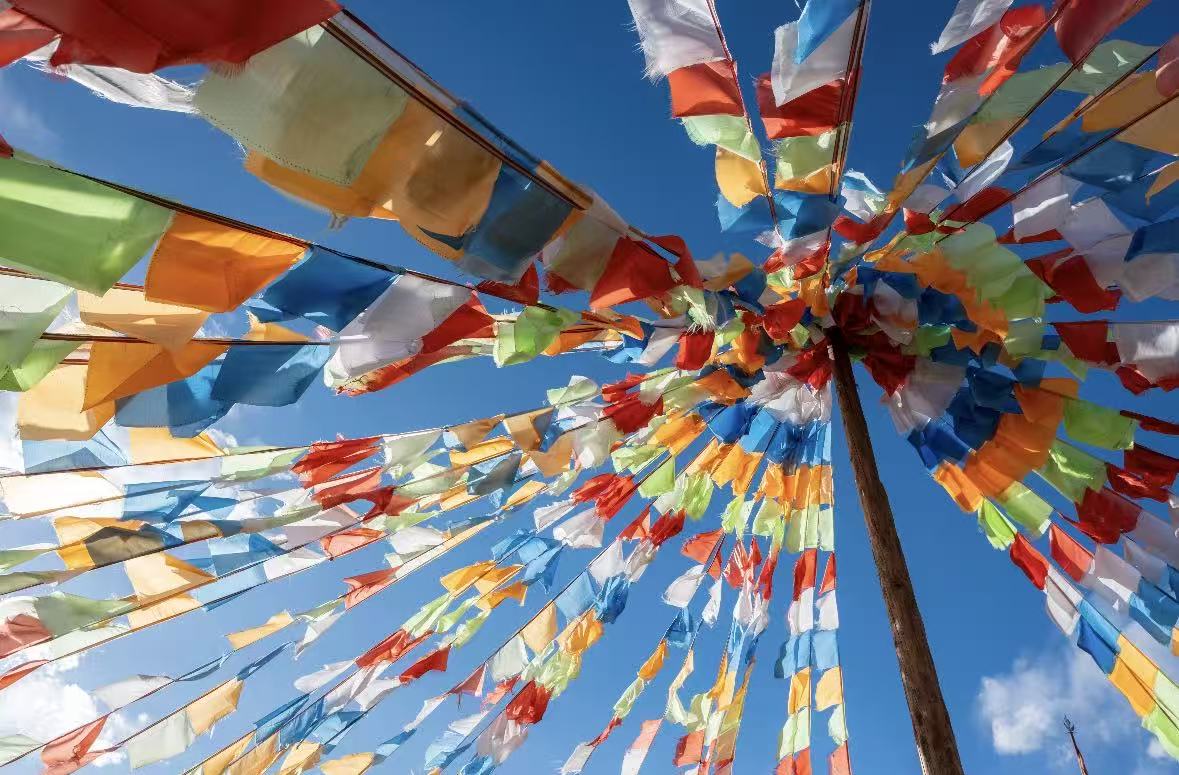 Hang prayer flags at mountain passes